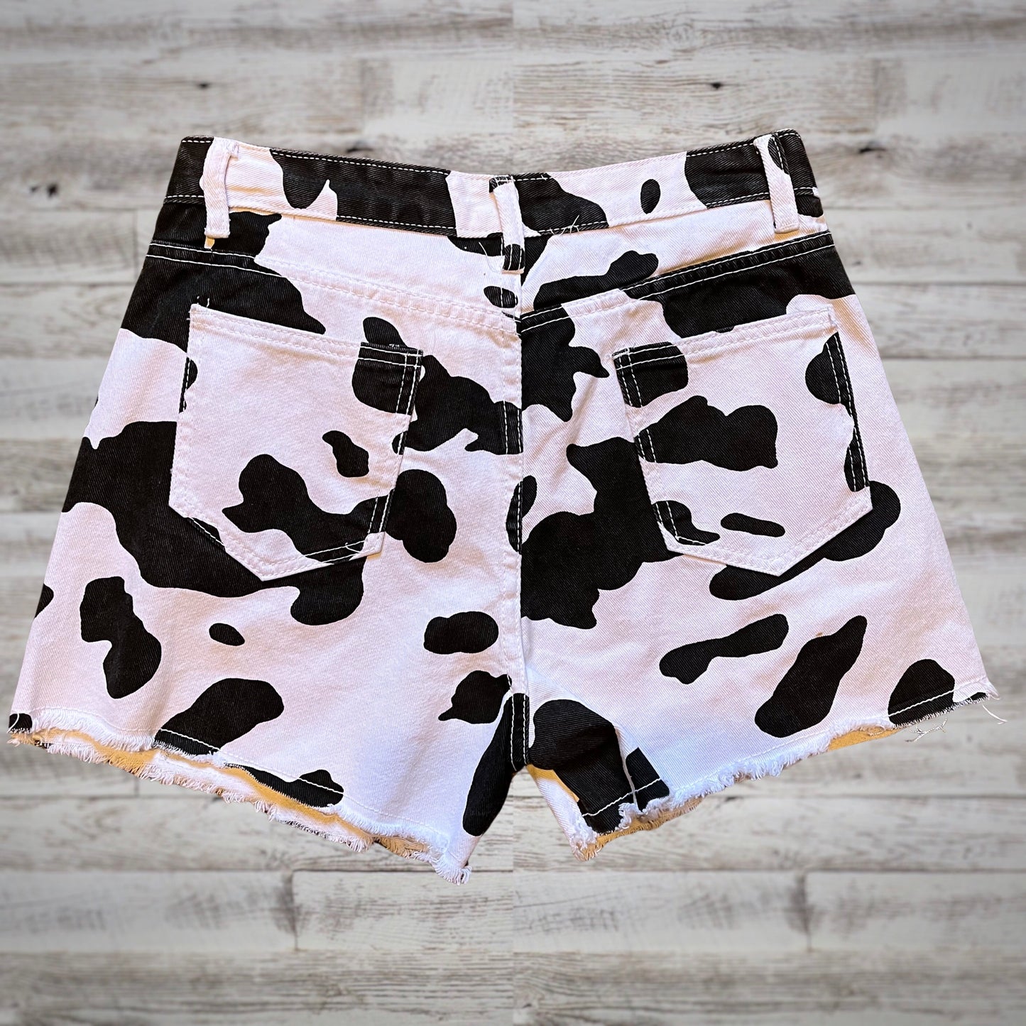 Yee-Haw Cow Print High Rise Denim Shorts